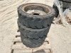APPROX. (4) RIMS W/TIRES, fits Bobcat skidsteer. --(LOCATED IN COLTON, CA)-- - 4