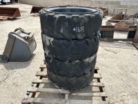 APPROX. (4) RIMS W/TIRES, fits Bobcat skidsteer. --(LOCATED IN COLTON, CA)--